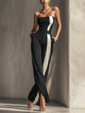 jumpsuit ללא רצועות נשים בשחור עם פסים אנכיים לבנים מנוגדים וכיסים צדדיים MDZ0336C7T
